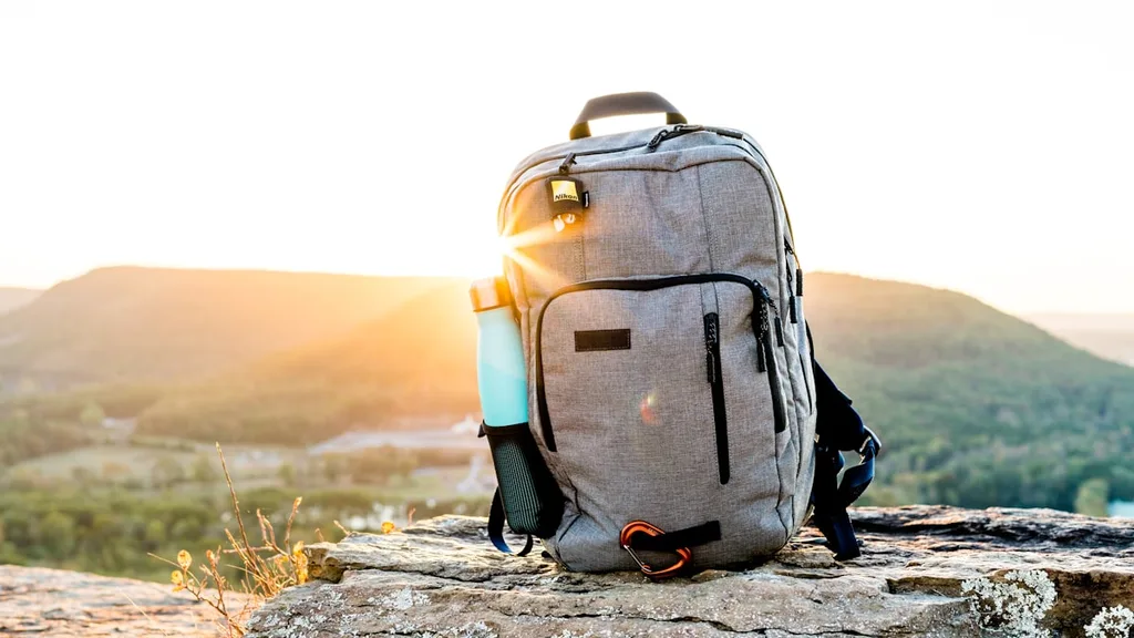 Best travel backpack packed backpack on wooden floor for digital nomads