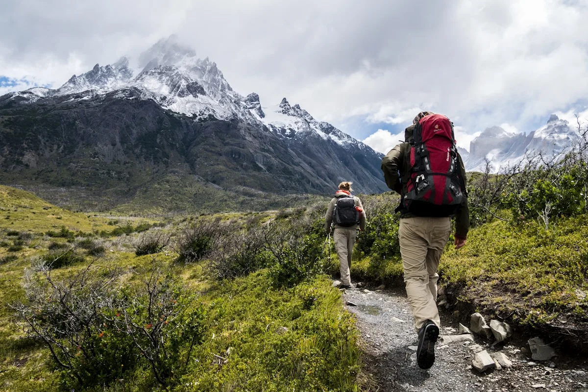 Digital nomad reviewing best travel insurance plans for nomads on laptop in 2026
