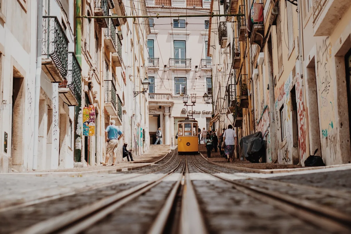 Digital nomad walking through Lisbon tiled streets while living the Portugal nomad lifestyle