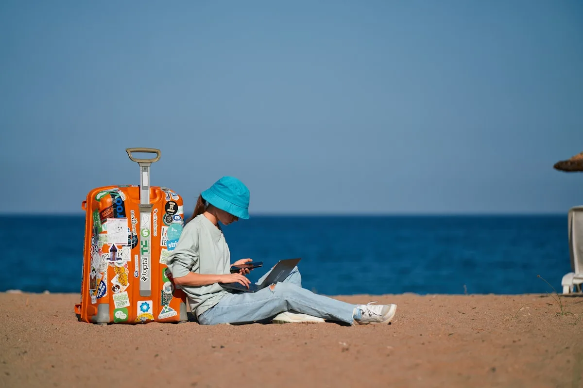 Digital nomad earning money online while working from tropical terrace cafe abroad
