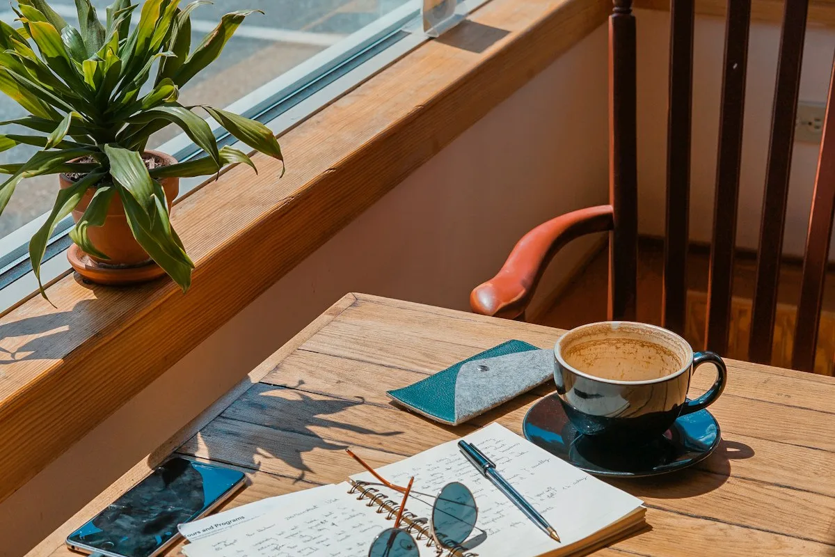 Digital nomad staying productive while working from a sunny cafe terrace