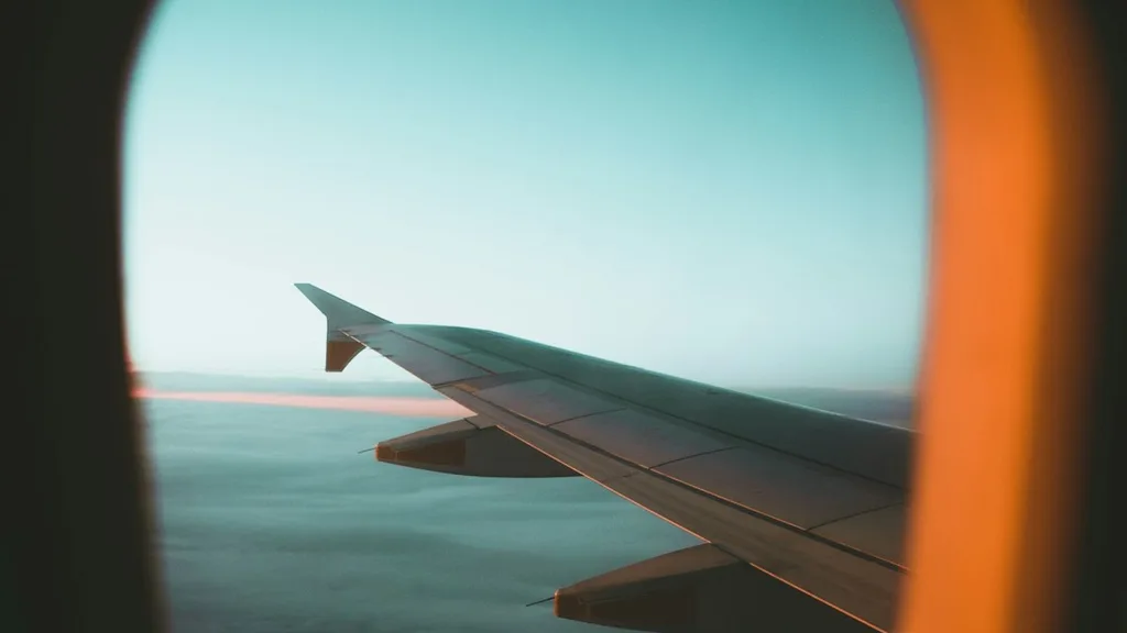 Skyscanner search on laptop showing cheapest flight options