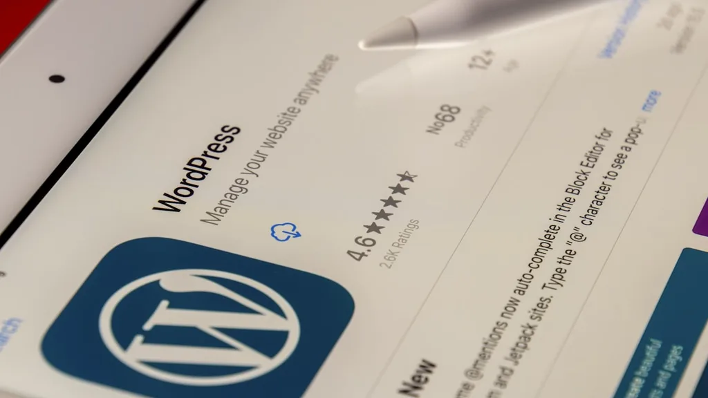Webflow vs WordPress portfolio WordPress block editor on monitor for digital nomads