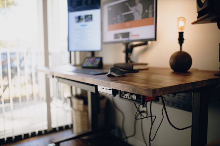 Compact home office setup with a portable standing desk converter