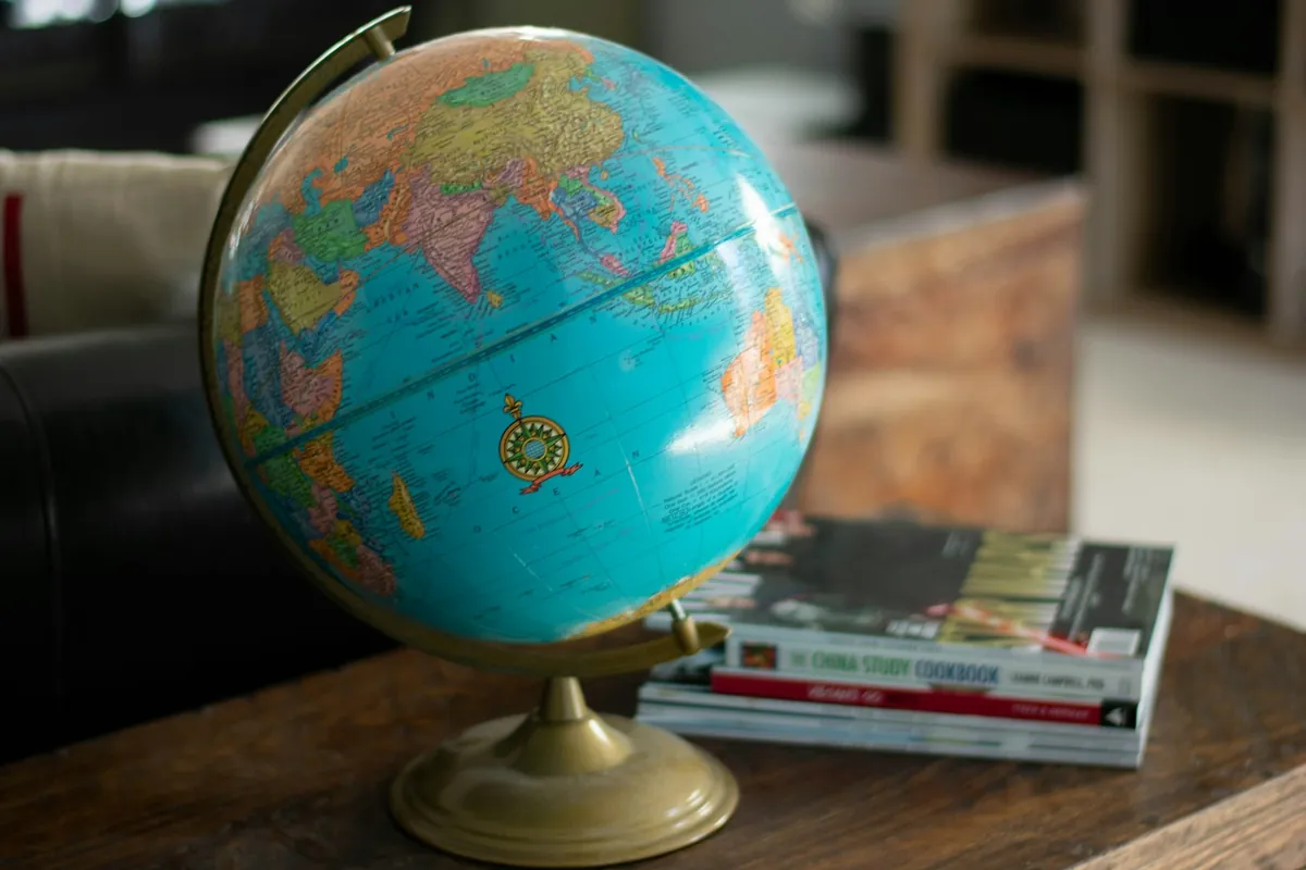Globe and travel books on a table