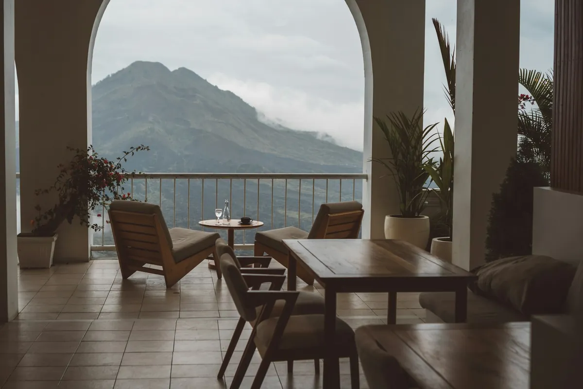 Open cafe terrace looking out over green hills