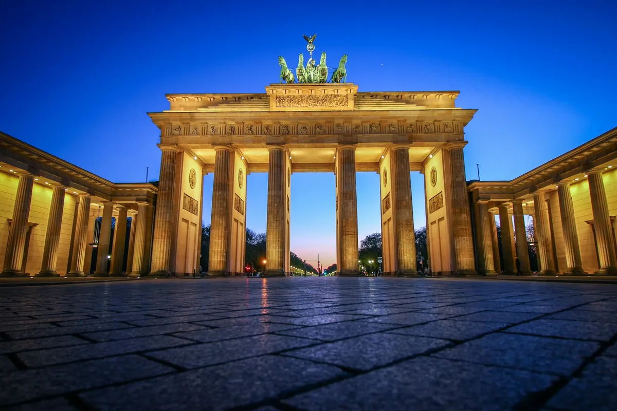 The Brandenburg Gate lit up at night in Berlin