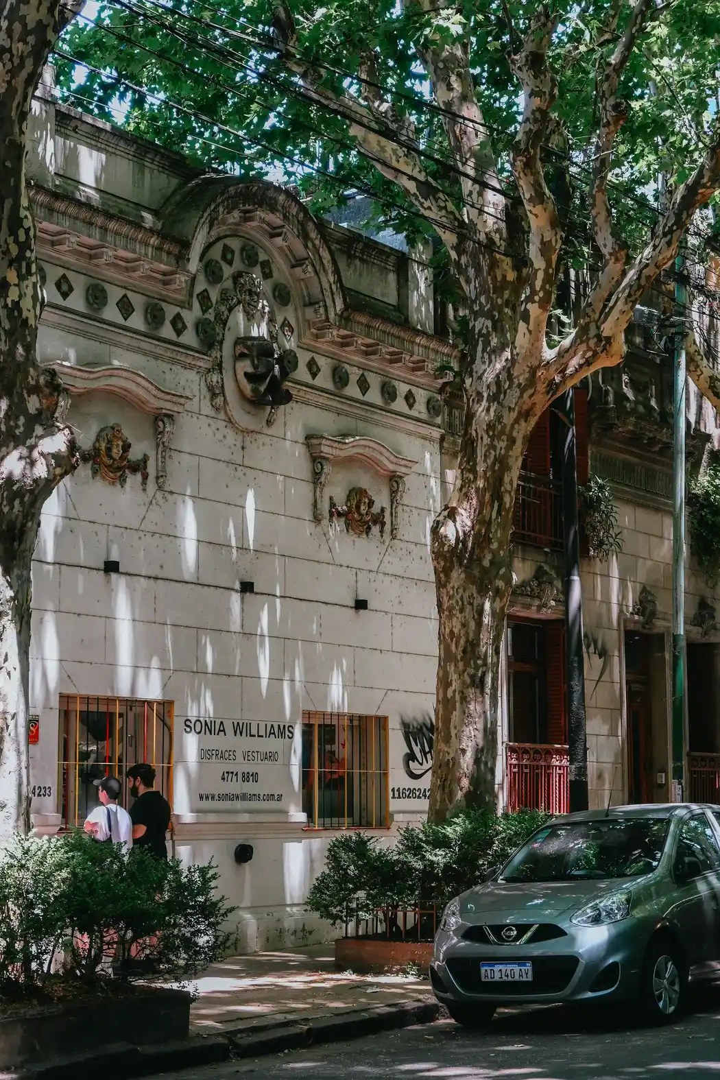 Tree-lined street with historic building in Palermo, Buenos Aires
