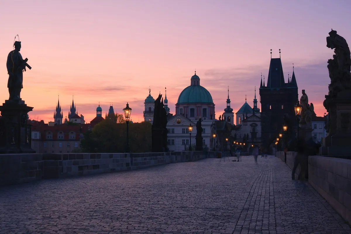 Charles Bridge and its statues at sunset in Prague