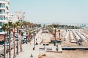 Larnaca promenade with palm trees and beach in Cyprus