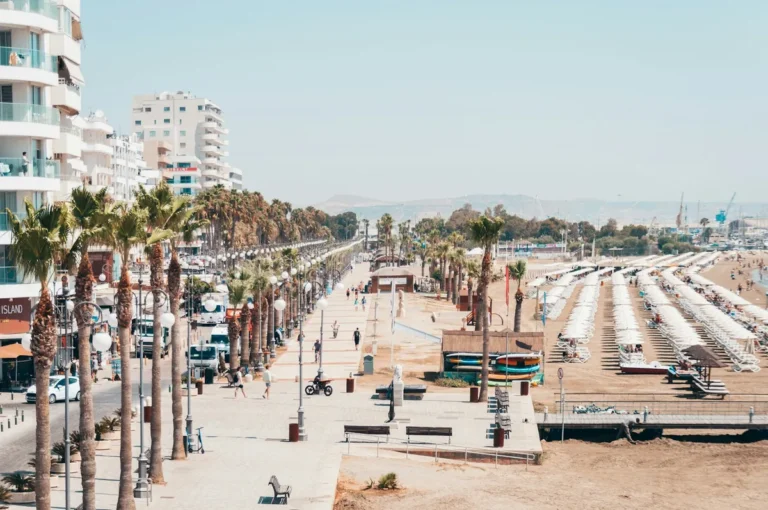 Larnaca promenade with palm trees and beach in Cyprus