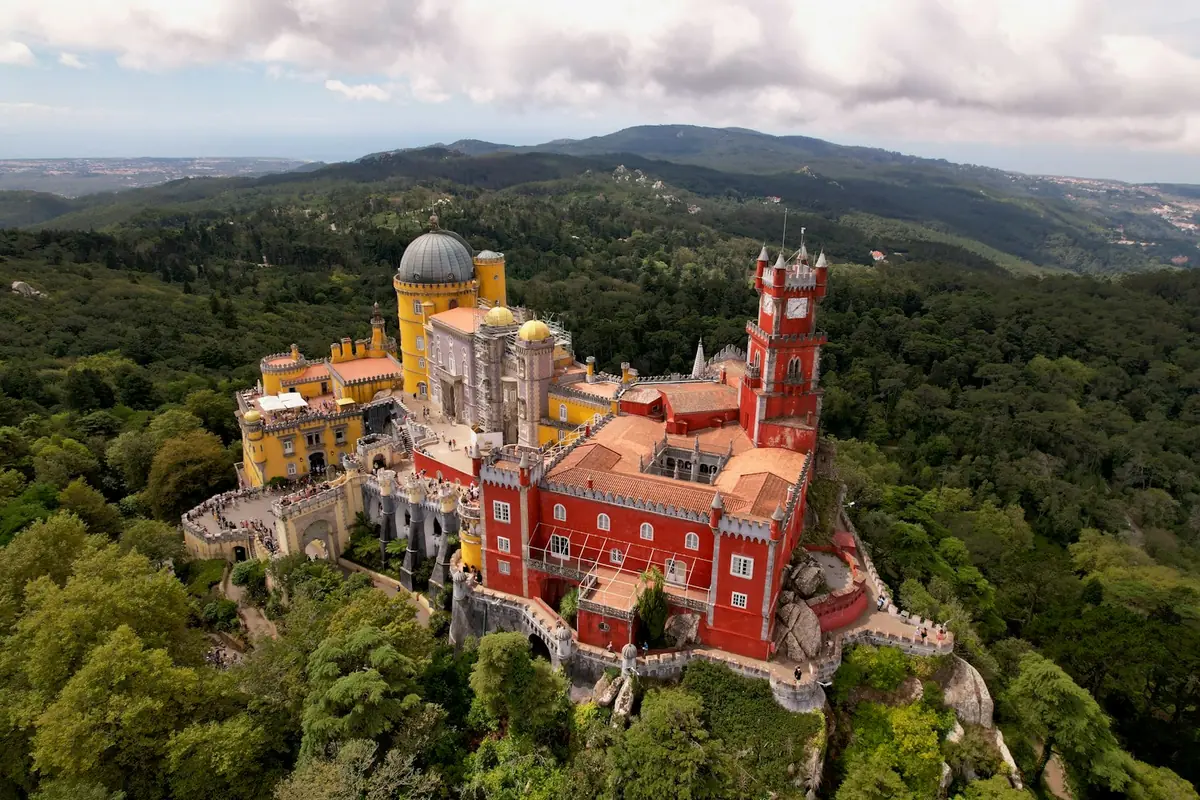 Colorful Pena Palace on a green hilltop in Sintra