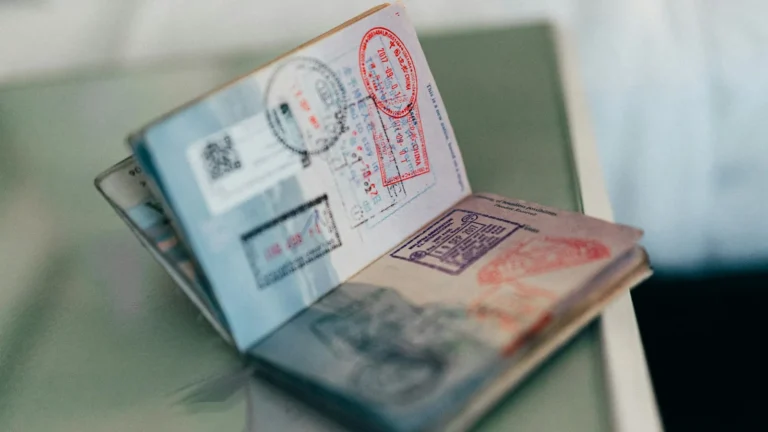 Open passport full of entry stamps from different countries