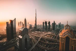 The Burj Khalifa towering over Downtown Dubai's skyline at sunset