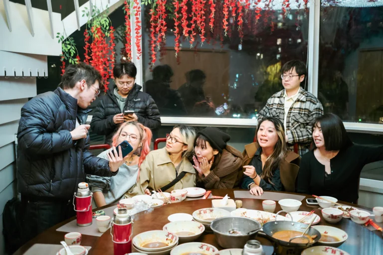 Group of friends gathered around a table for a meal
