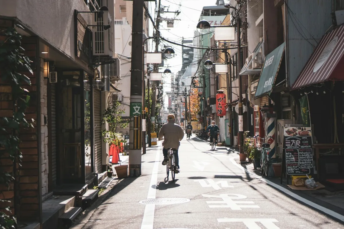 Quiet residential street with a cyclist in Tokyo, Japan