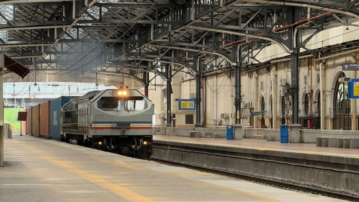 A train arriving at a railway station platform in Kuala Lumpur, Malaysia