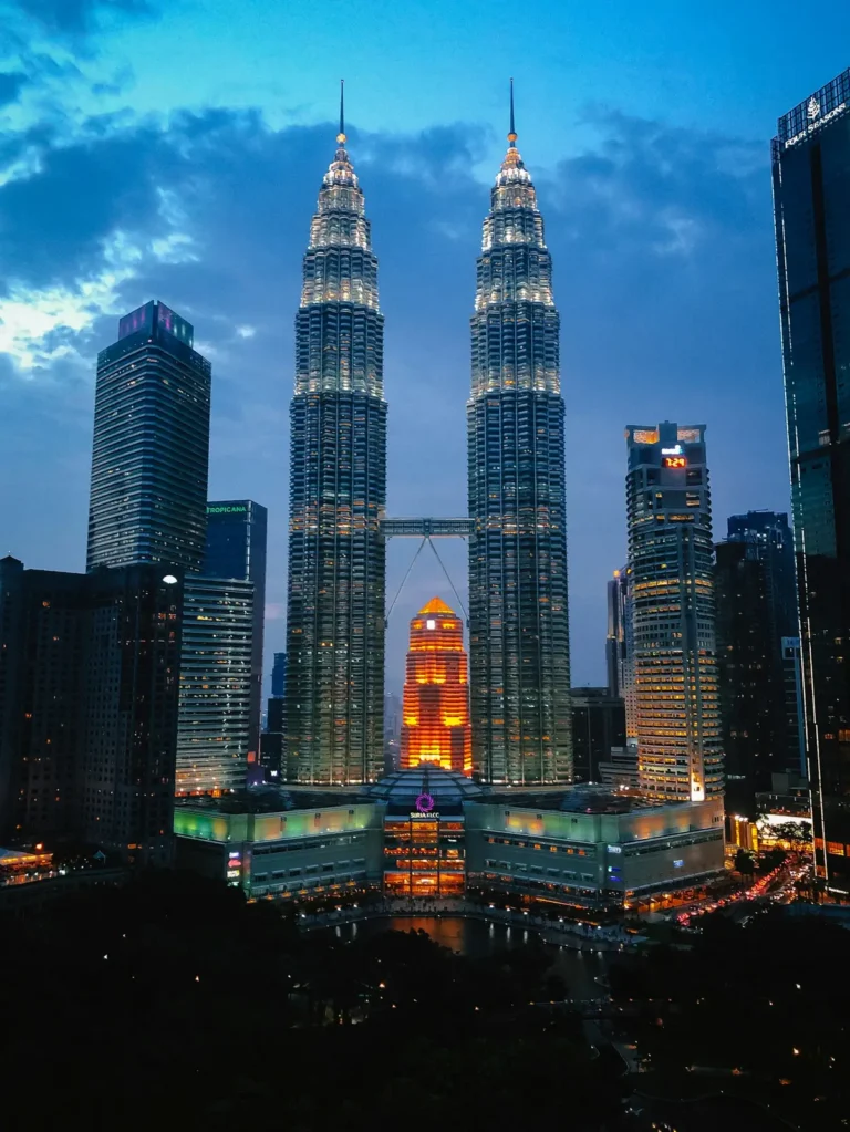 The Petronas Twin Towers illuminated at night in Kuala Lumpur