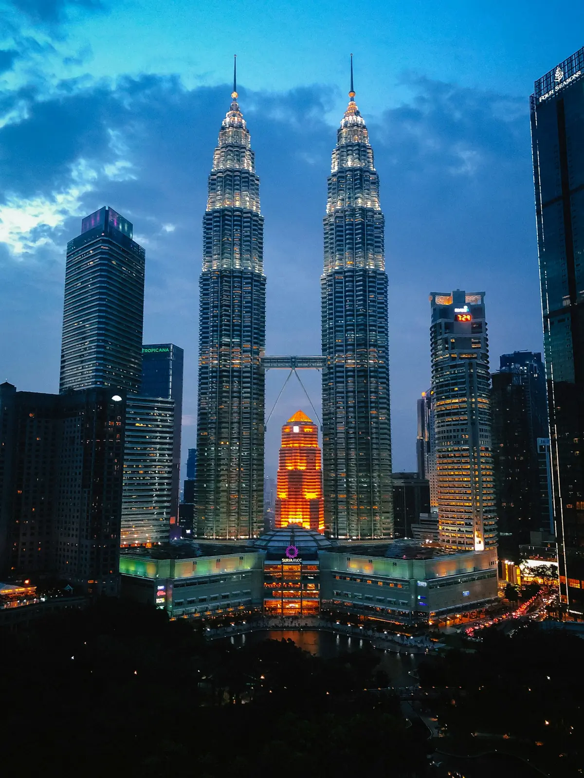 The Petronas Twin Towers illuminated at night in Kuala Lumpur
