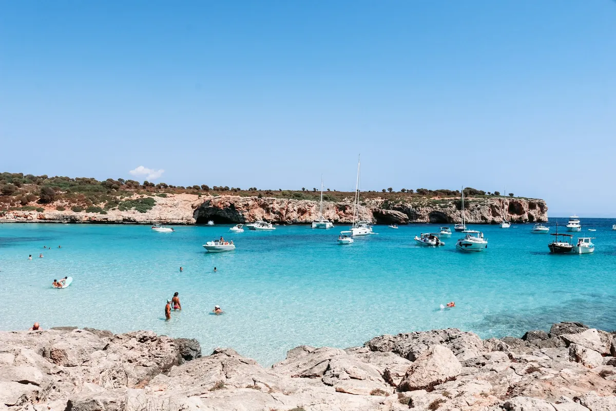 Turquoise water at a white sand beach on Mallorca's coast