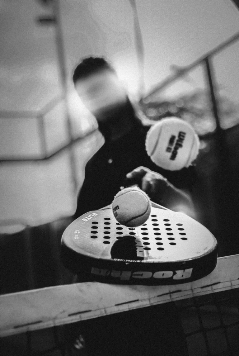 Padel player striking the ball during a rally