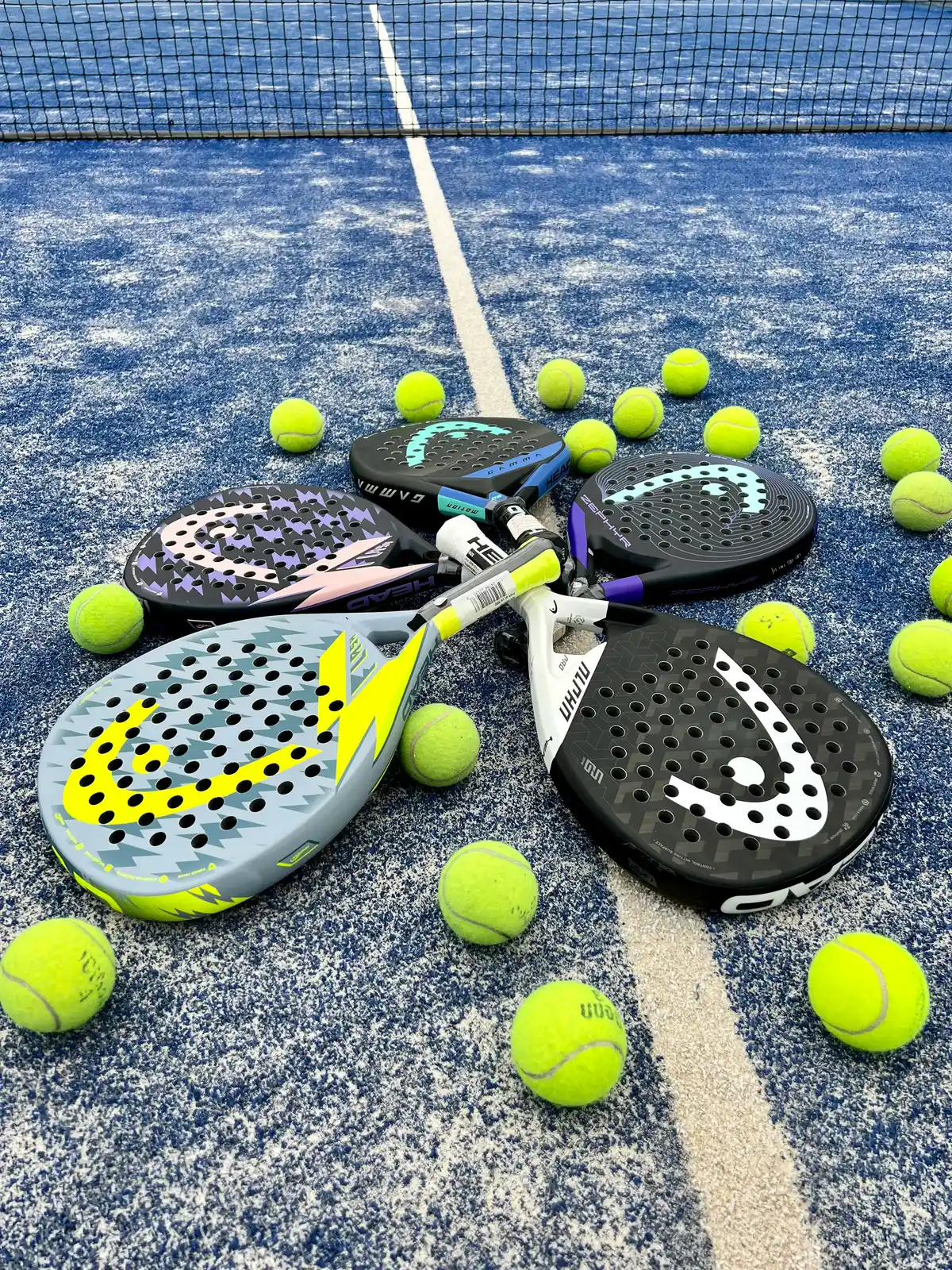 Padel rackets and balls arranged for beginners choosing their first racket
