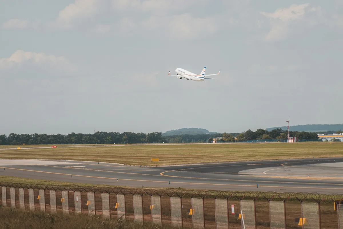 An airplane taking off from the runway near Prague