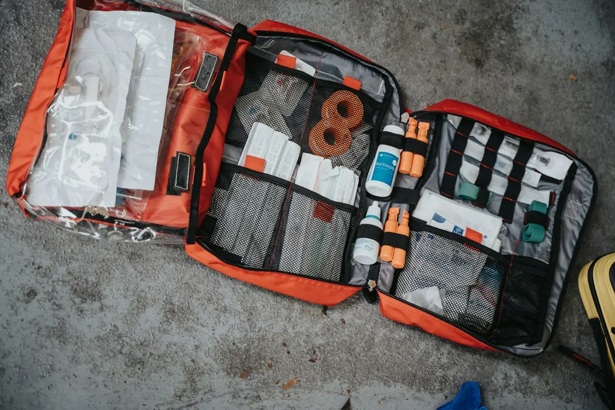 Open first aid kit with bandages and medical supplies for travel