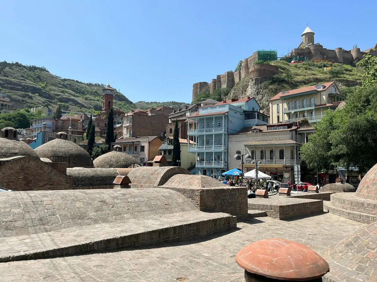 Domed sulfur bathhouses of Abanotubani below Narikala Fortress in Tbilisi