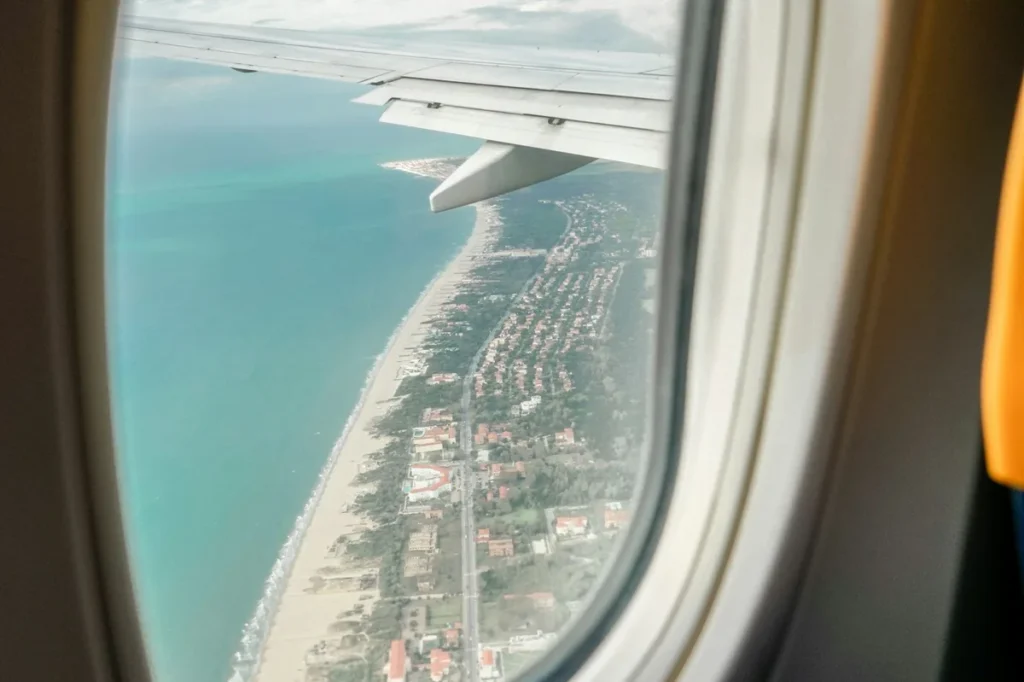 City seen from above through an airplane window