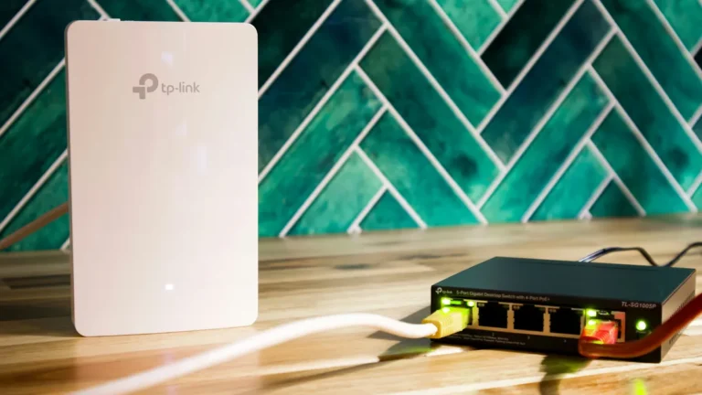 Wifi router and network switch on a wooden table, best portable wifi hotspots for travel