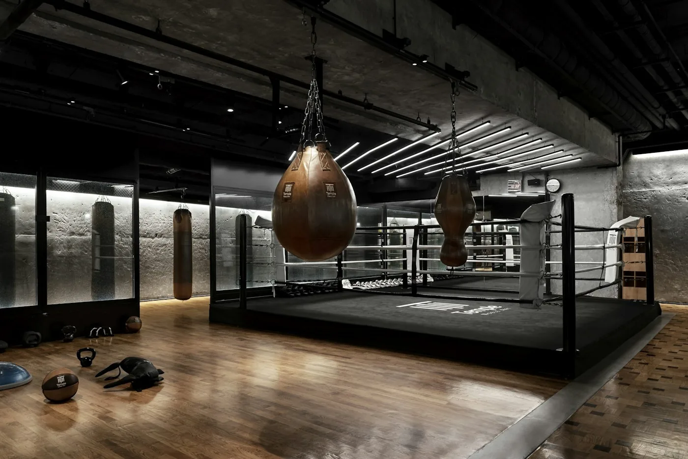 Boxing gym with a ring, speed bags and a wooden floor, a place to train while traveling