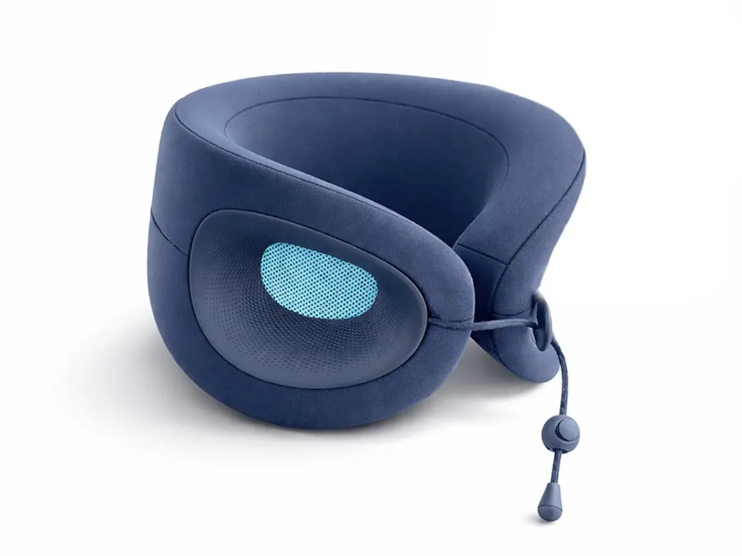 Navy blue Cabeau Evolution X neck pillow with a light blue cooling vent on the side shell and a pull cord