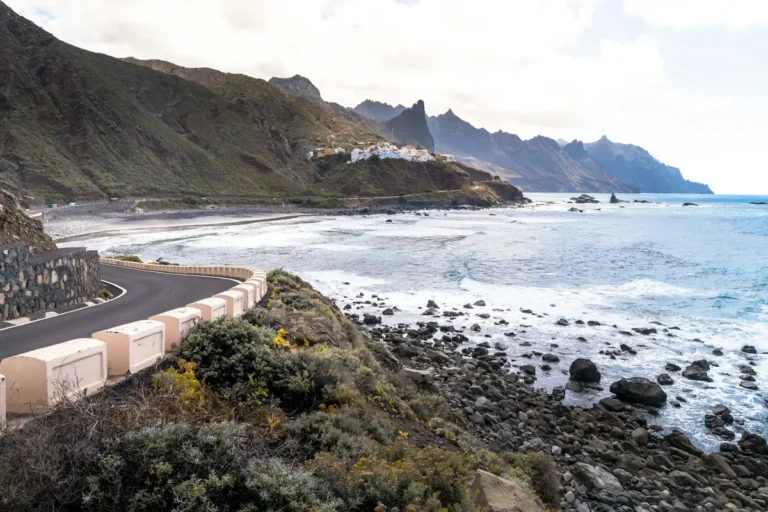 Winding coastal road above the sea at Playa de Benijo, car rental in Spain