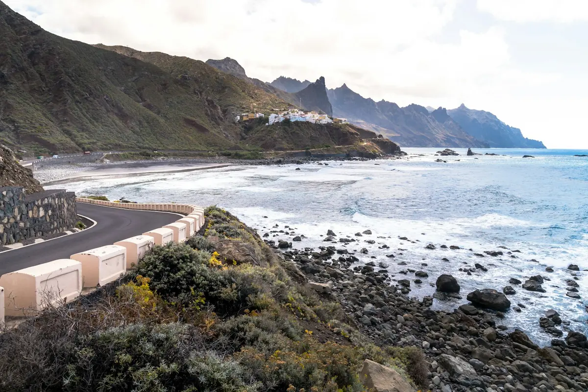 Winding coastal road above the sea at Playa de Benijo, car rental in Spain
