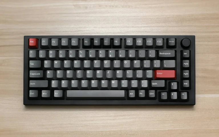 Compact black mechanical keyboard on a wooden table