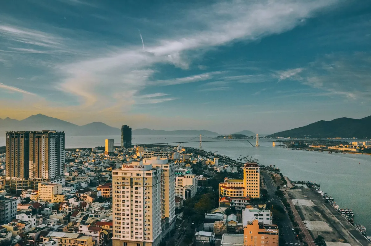 Da Nang high-rise buildings and the river under a streaked evening sky