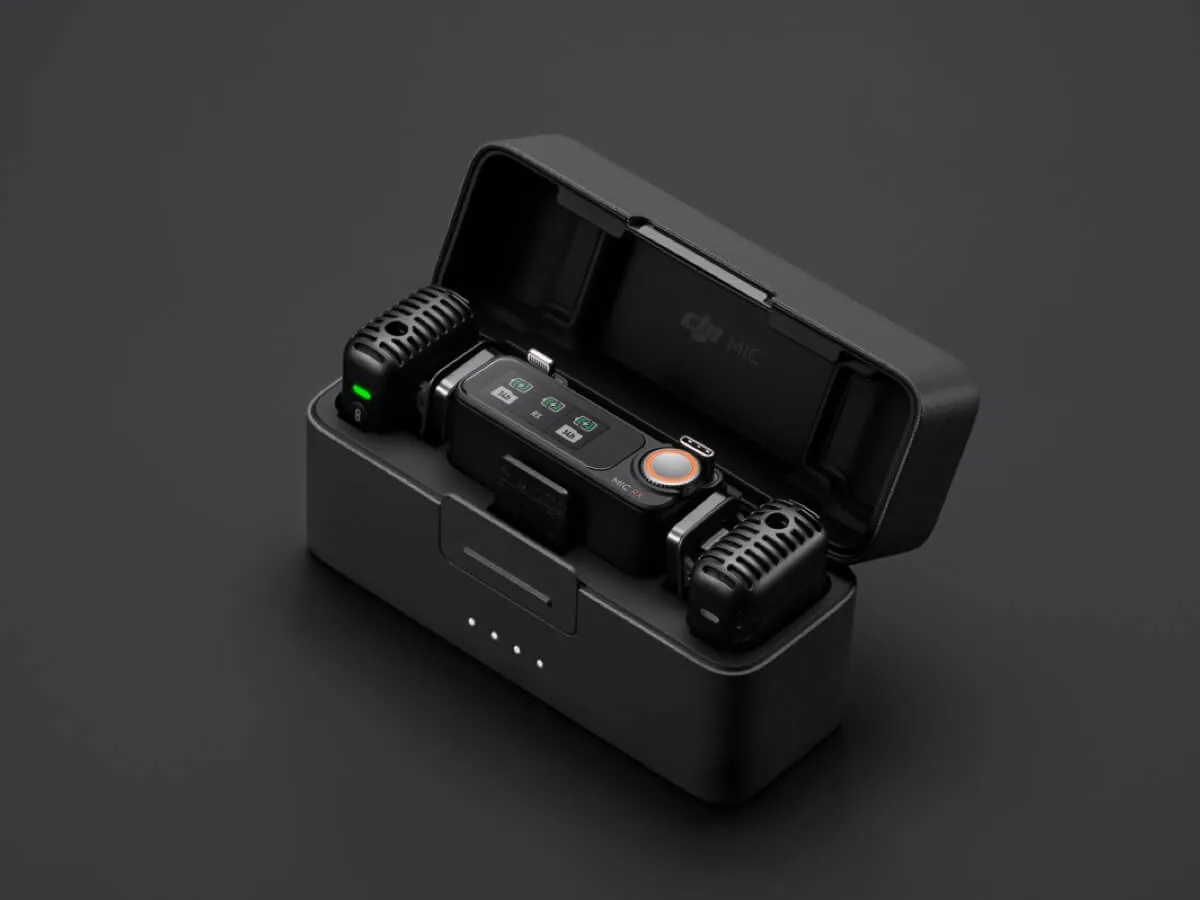 DJI Mic 2 charging case open with two transmitters and one receiver inside