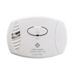 First Alert CO400 white battery carbon monoxide alarm with a test and silence button, seen from the front