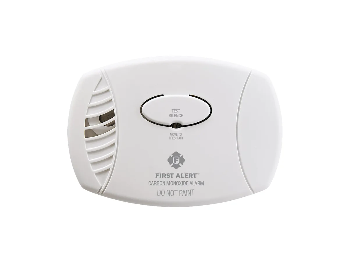 First Alert CO400 white battery carbon monoxide alarm with a test and silence button, seen from the front