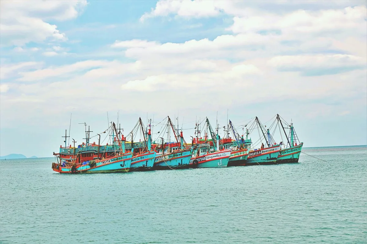 Cluster of colorful fishing boats on the Gulf of Thailand