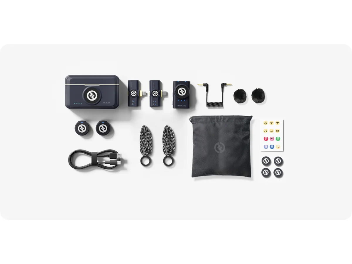 Hollyland Lark M2 Combo kit laid flat: charging case, two transmitters, three receivers, windscreens, cables and a pouch