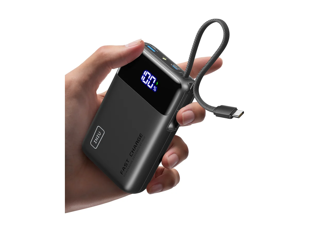 INIU Carry 20000mAh power bank in black held in a hand, with a built-in USB-C cable and display