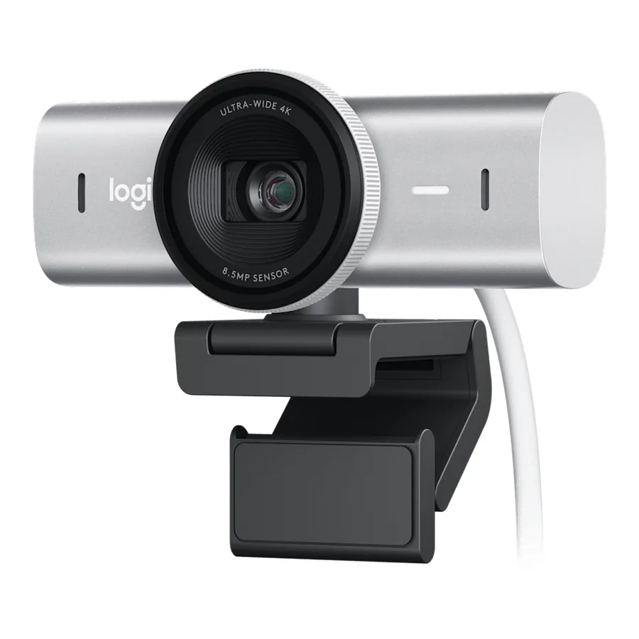 Logitech MX Brio 4K webcam in pale gray on its clip, with a white cable