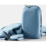 Matador NanoDry packable shower towel in blue next to its silicone case