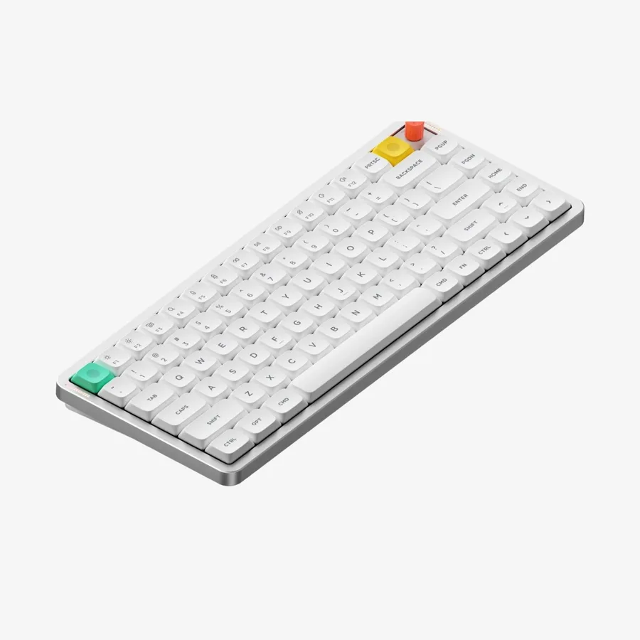 White NuPhy Air75 V3 low-profile wireless keyboard seen at an angle with a red knob and coloured accent keys