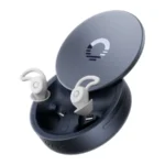 Ozlo Sleepbuds 2 in their open round blue-grey smart case with two cream earbuds and wing tips