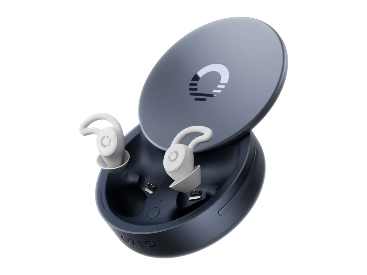Ozlo Sleepbuds 2 in their open round blue-grey smart case with two cream earbuds and wing tips