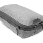 Peak Design packing cube in grey with an expansion zip around the side