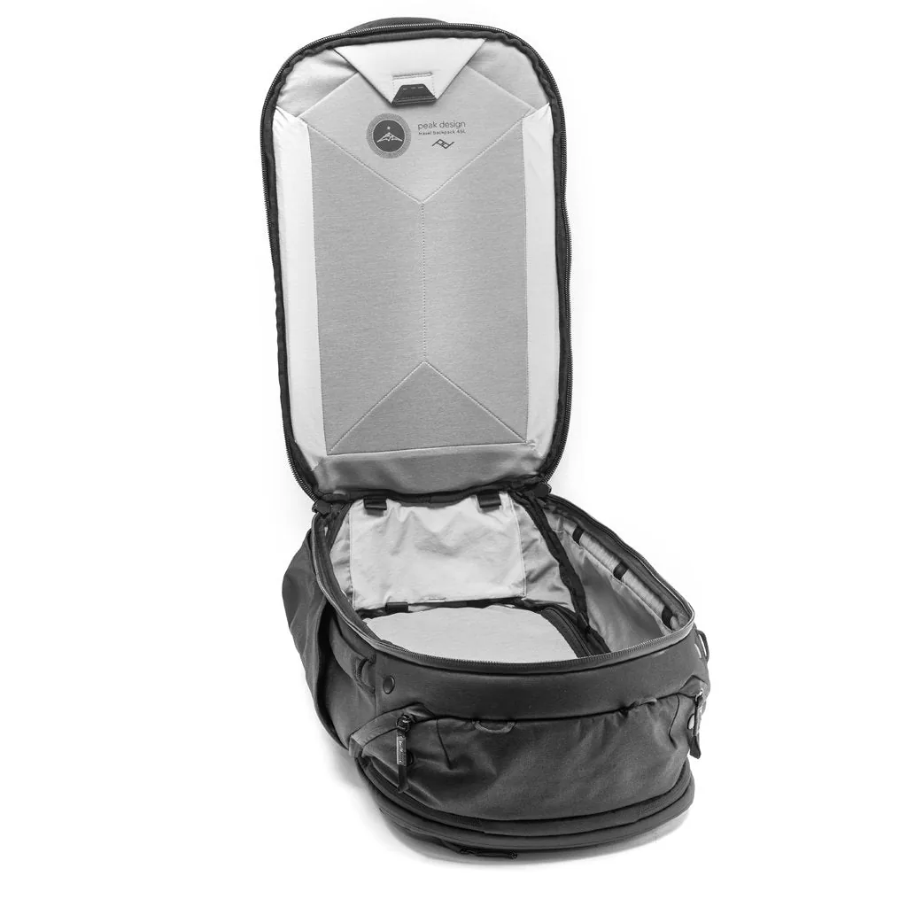 Black Peak Design Travel Backpack 45L opened like a clamshell showing the grey interior
